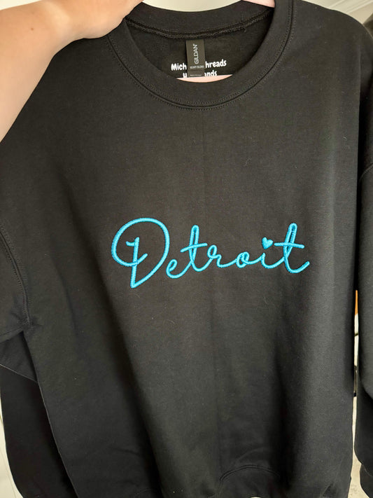 Detroit in Blue Script on Black Crewneck Sweatshirt Crew Neck Sweatshirt