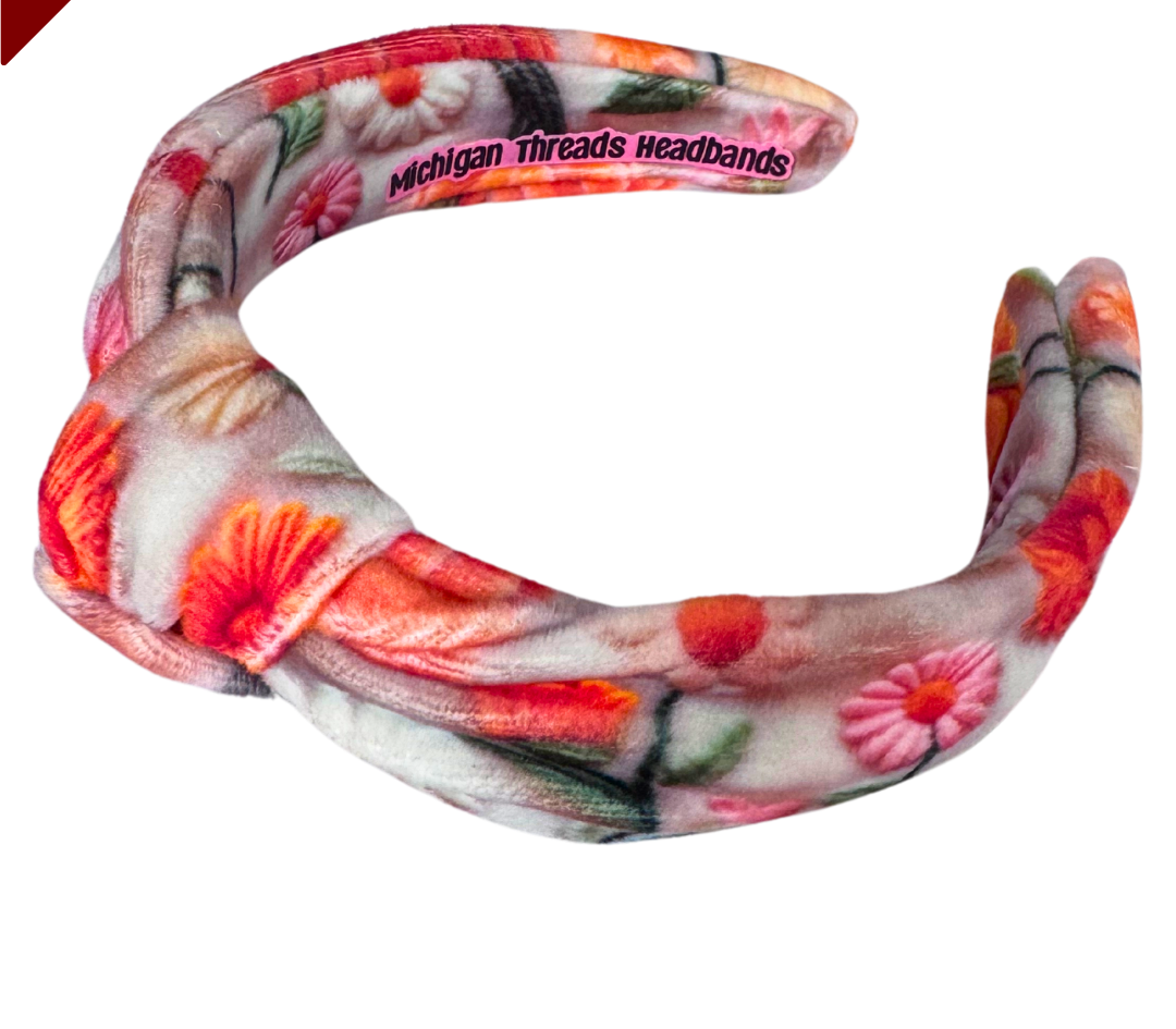 Floral patterned headband with 'Michigan Threads Headbands' branding on a white background