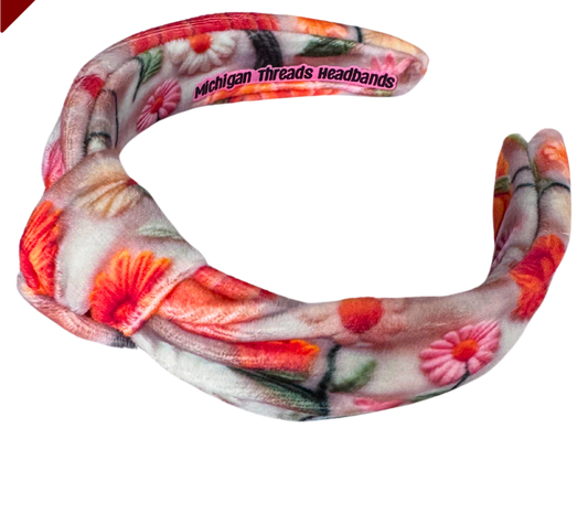 Floral patterned headband with 'Michigan Threads Headbands' branding on a white background