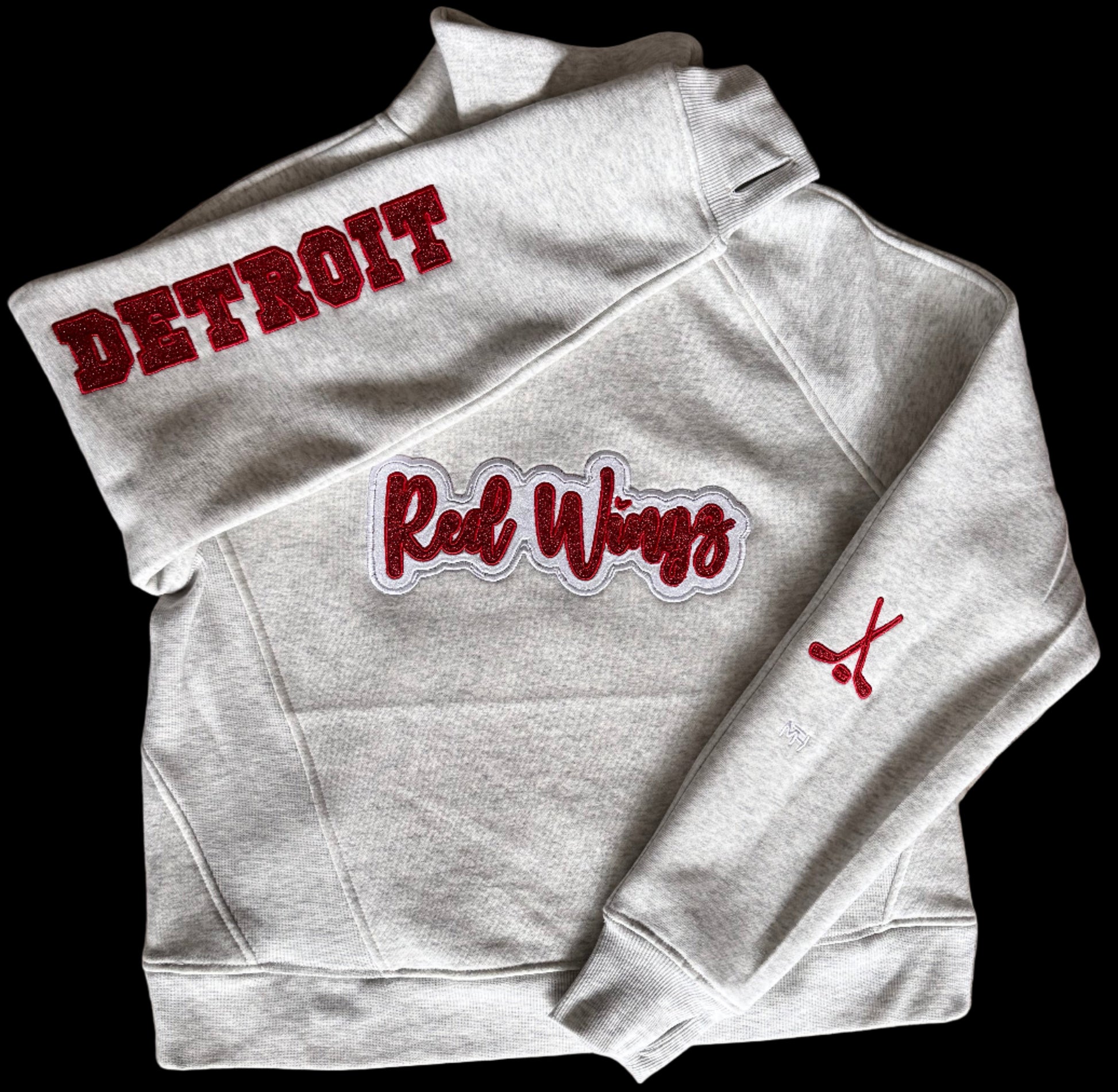 Folded hoodie with 'Detroit Red Wings' text