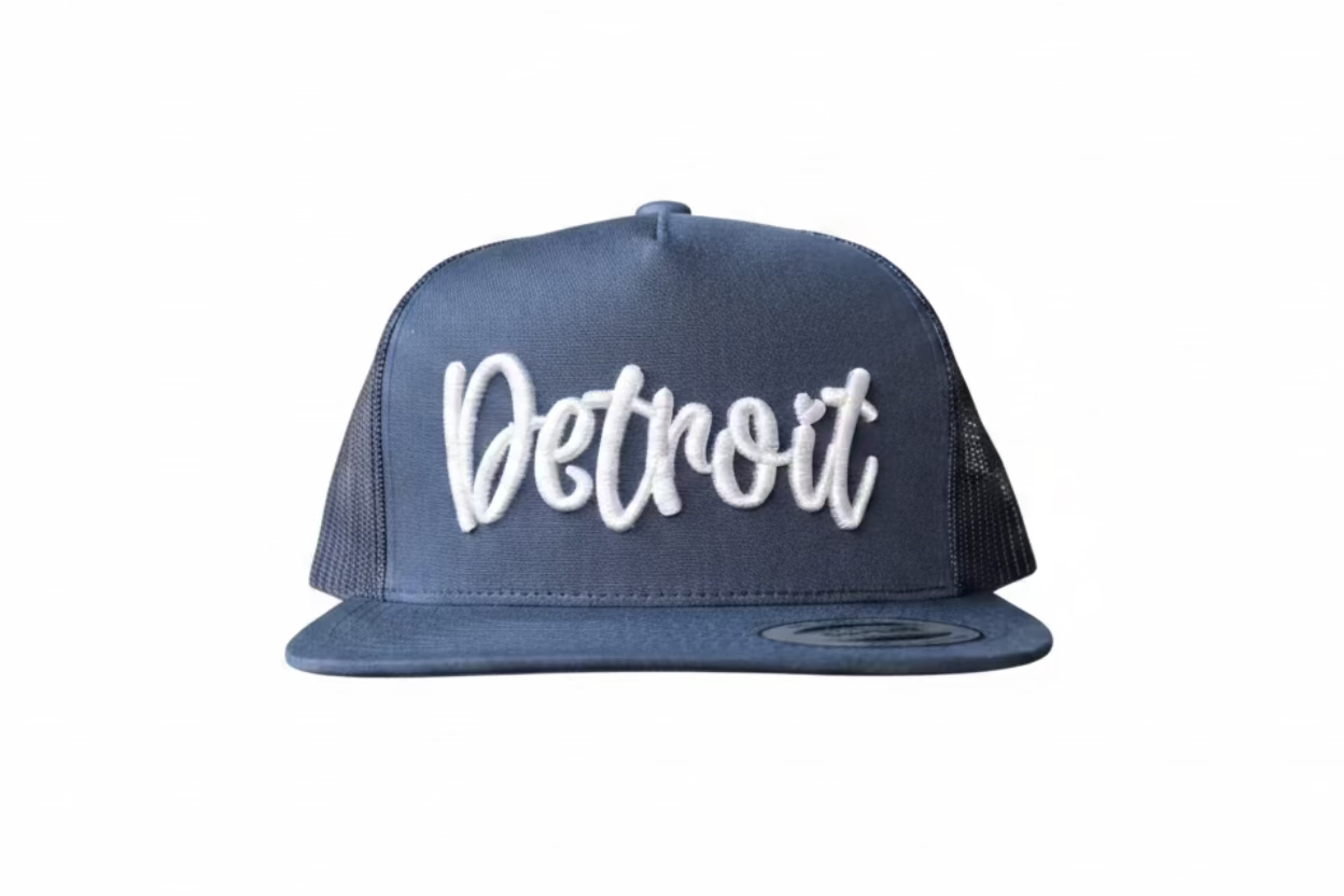 Navy blue Detroit trucker hat with white raised 3D puff script embroidery