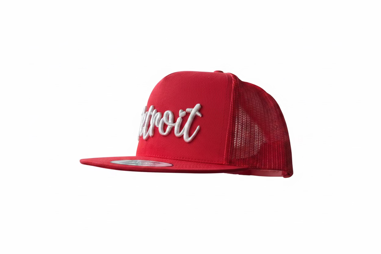 Red Detroit sports hat with white 3D puff script on a Yupoong 6606 trucker cap