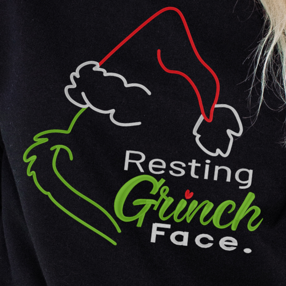 Black sweatshirt with 'Resting Grinch Face' design on a person wearing it.